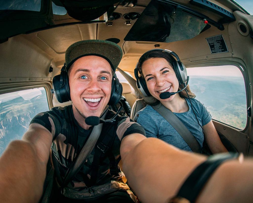 Two young people in the cockpit of a private airplane