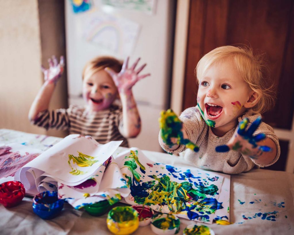 Kids playing with finger paints
