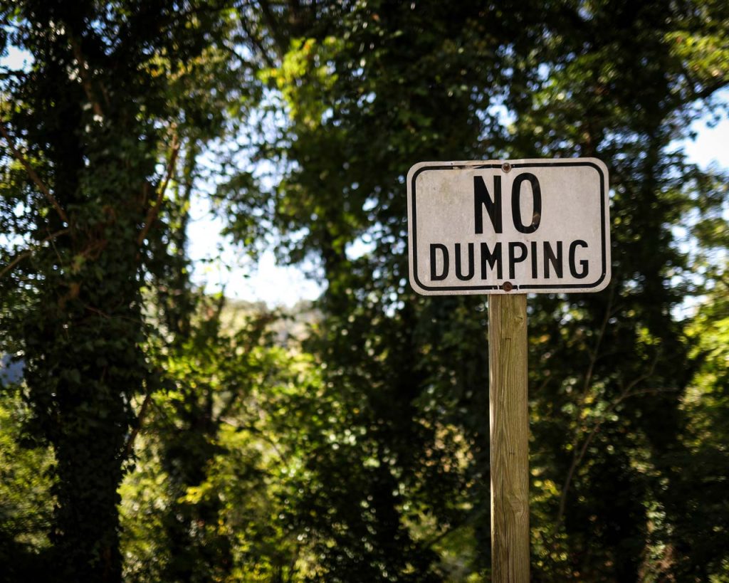 No Dumping sign in the woods